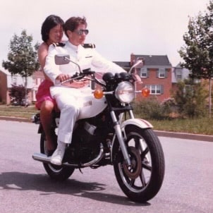 Russ Bartlett on his motorcycle with wife